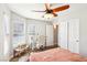 Bright bedroom with a built in desk and a ceiling fan at 3913 Ricebird Way, North Las Vegas, NV 89084