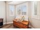 Comfortable bedroom seating area features wood flooring and natural light at 3913 Ricebird Way, North Las Vegas, NV 89084