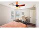 Cozy bedroom with natural light streaming through the window and a ceiling fan at 3913 Ricebird Way, North Las Vegas, NV 89084