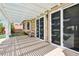 Spacious covered patio with a pergola, offering shade and access to the backyard pool at 3913 Ricebird Way, North Las Vegas, NV 89084