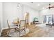 Bright dining area with hardwood floors, a round table, seating for four, open concept, and neutral paint at 3913 Ricebird Way, North Las Vegas, NV 89084
