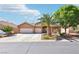 Inviting single-story home featuring a two-car garage, desert landscaping, and a private driveway at 3913 Ricebird Way, North Las Vegas, NV 89084