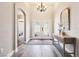 The foyer features wood floors, neutral walls and trim, and a front door at 3913 Ricebird Way, North Las Vegas, NV 89084
