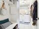 Laundry and mud room with a modern washer and dryer, and a bench for shoes and coats at 3913 Ricebird Way, North Las Vegas, NV 89084