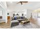 Spacious living area with an open layout flowing into a modern kitchen, perfect for entertaining and Gathering gatherings at 3913 Ricebird Way, North Las Vegas, NV 89084