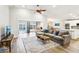 Expansive living space featuring seamless access to a kitchen and backyard with a pool at 3913 Ricebird Way, North Las Vegas, NV 89084