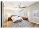 Relaxing bedroom with natural light, hardwood floors, and a vaulted ceiling at 3913 Ricebird Way, North Las Vegas, NV 89084