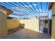 Private back patio with concrete flooring and wrought iron pergola at 3925 Torsby Pl, Las Vegas, NV 89119