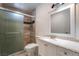 Well-lit bathroom featuring a vanity, mirror, and glass-enclosed shower at 3925 Torsby Pl, Las Vegas, NV 89119