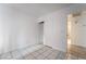 Bedroom with closet, tile floors, and access to a bathroom at 3925 Torsby Pl, Las Vegas, NV 89119