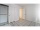 Bedroom with closet, tile floors, and access to a bathroom at 3925 Torsby Pl, Las Vegas, NV 89119