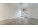 Sunlit bedroom with tile flooring, a window with natural light and access to hall at 3925 Torsby Pl, Las Vegas, NV 89119