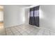 Bright bedroom features tile flooring, base molding and light entering window at 3925 Torsby Pl, Las Vegas, NV 89119