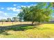 Large common area with grass, trees and a covered bench at 3925 Torsby Pl, Las Vegas, NV 89119
