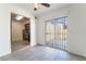 Dining room with tiled floors, ceiling fan and slider leading to patio at 3925 Torsby Pl, Las Vegas, NV 89119
