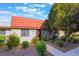 Charming single-story home featuring a red tile roof and well-manicured landscaping at 3925 Torsby Pl, Las Vegas, NV 89119