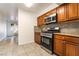 Updated kitchen featuring stainless steel appliances, granite countertops, and stylish backsplash at 3925 Torsby Pl, Las Vegas, NV 89119