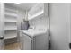 Well-organized laundry area with modern washer and dryer and shelving at 3925 Torsby Pl, Las Vegas, NV 89119
