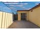 Enclosed patio with metal pergola cover, stucco walls, and stamped concrete flooring at 3925 Torsby Pl, Las Vegas, NV 89119