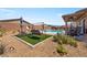 Inviting backyard featuring a private pool, relaxing lounge area, and decorative landscaping at 3966 E Garfield Dr, Pahrump, NV 89061