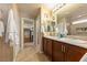 Ensuite bathroom boasts double sinks, walk-in shower, and walk-in closet at 3966 E Garfield Dr, Pahrump, NV 89061