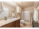 This bathroom features a vanity with granite countertop, a shower-tub combination, and neutral color palette at 3966 E Garfield Dr, Pahrump, NV 89061