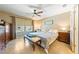 Bright bedroom featuring a ceiling fan, neutral walls and ensuite bath at 3966 E Garfield Dr, Pahrump, NV 89061