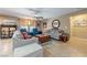 Cozy living room with neutral walls, comfortable furniture, and a ceiling fan to circulate air at 3966 E Garfield Dr, Pahrump, NV 89061