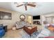 Bright living room features tile flooring, neutral color palette, and plenty of natural light from windows at 3966 E Garfield Dr, Pahrump, NV 89061