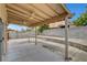 Large backyard patio with covered pergola, fan and concrete flooring perfect for entertaining at 4008 Lighthouse Ave, Las Vegas, NV 89110
