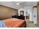 Cozy bedroom features natural light, ceiling fan, and mirrored closet at 4008 Lighthouse Ave, Las Vegas, NV 89110