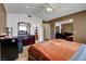 Cozy bedroom features natural light, ceiling fan, and mirrored closet at 4008 Lighthouse Ave, Las Vegas, NV 89110