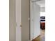 Open bedroom door reveals comfortable bedroom with carpet and natural light at 4008 Lighthouse Ave, Las Vegas, NV 89110