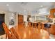 Spacious dining area with wood table, chairs, and breakfast bar connecting to kitchen at 4008 Lighthouse Ave, Las Vegas, NV 89110