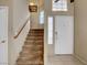 Inviting entryway featuring stairs leading to the upper level and a front door with sidelight window at 4008 Lighthouse Ave, Las Vegas, NV 89110
