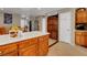Kitchen featuring wooden cabinets, white counters, and stainless steel appliances at 4008 Lighthouse Ave, Las Vegas, NV 89110