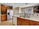 Kitchen featuring a stainless steel refrigerator and wooden cabinets at 4008 Lighthouse Ave, Las Vegas, NV 89110