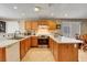 U-shaped kitchen layout with stainless steel appliances and tile backsplash at 4008 Lighthouse Ave, Las Vegas, NV 89110