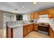 View of the kitchen featuring wooden cabinets, countertops and appliances at 4008 Lighthouse Ave, Las Vegas, NV 89110