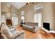 Bright living room with high ceilings, hardwood floors, and ample natural light at 4008 Lighthouse Ave, Las Vegas, NV 89110