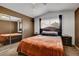 Inviting main bedroom with mirrored closet, ceiling fan, and a queen-sized bed at 4008 Lighthouse Ave, Las Vegas, NV 89110