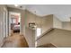 Carpeted stairs with wooden handrail leading to the upper level, with view of bedroom at 4008 Lighthouse Ave, Las Vegas, NV 89110