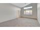 Spacious carpeted bedroom with lots of natural light from horizontal window at 4331 Golden Palomino Ln, North Las Vegas, NV 89032