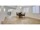 Bright dining area with views of the stairs, modern chairs, wood floors, and access to other rooms at 4331 Golden Palomino Ln, North Las Vegas, NV 89032