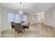 Cozy dining area features modern lighting, neutral walls, and easy access to the entryway at 4331 Golden Palomino Ln, North Las Vegas, NV 89032