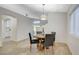 Bright dining area with modern chairs, wood floors, and easy access to kitchen and living spaces at 4331 Golden Palomino Ln, North Las Vegas, NV 89032