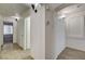 Hallway features wood-look tile floors, neutral paint, and modern sconces at 4331 Golden Palomino Ln, North Las Vegas, NV 89032