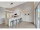 Open kitchen with breakfast bar, pendant lighting, and stainless steel appliances at 4331 Golden Palomino Ln, North Las Vegas, NV 89032