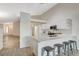 Modern kitchen with breakfast bar, white cabinets, and ample counter space at 4331 Golden Palomino Ln, North Las Vegas, NV 89032