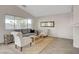 Comfortable living area featuring a large window and neutral tones for a relaxing atmosphere at 4331 Golden Palomino Ln, North Las Vegas, NV 89032